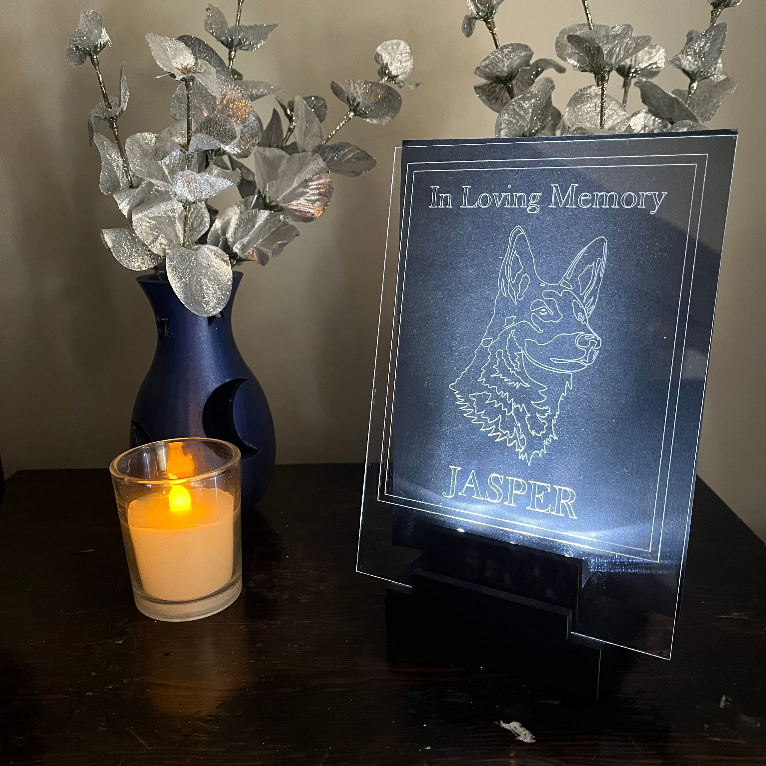 An LED stand with an engraved acrylic sheet featuring a pet memorial.